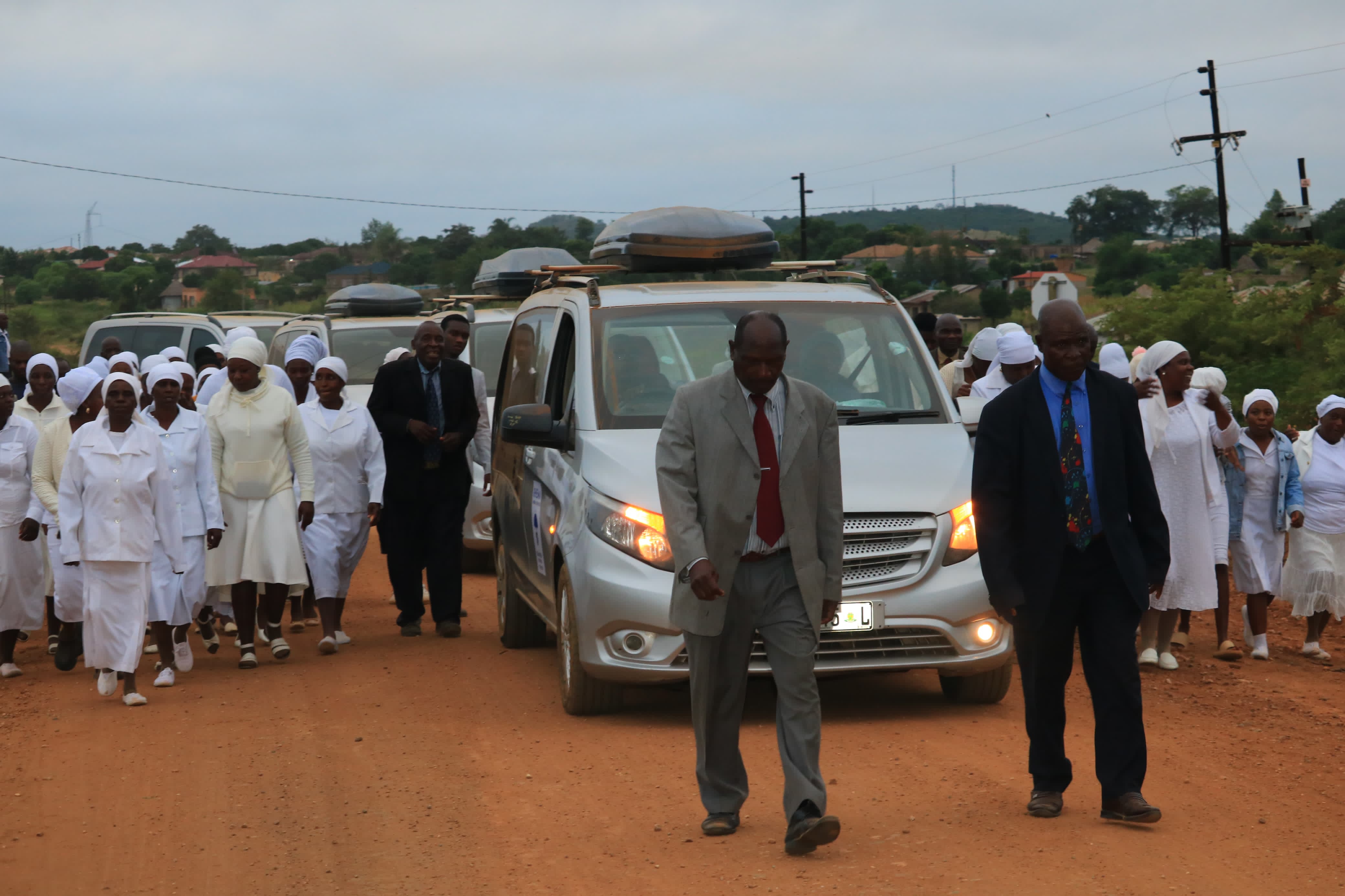 Lead funeral vehicle with family and service attendants